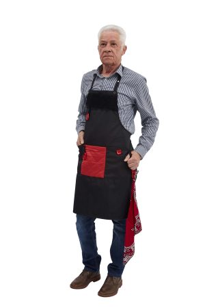 Belevingsschort in de kleur zwart, wasbaar, met regelbaar halslint